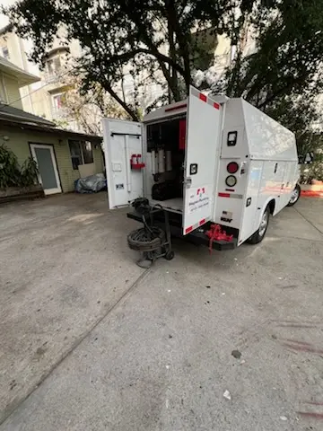 Magnet Plumbing service vehicle on-site for Grease Trap Cleaning in Rockledge